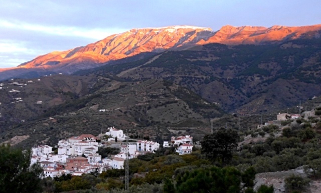 The first of the morning sun hitting mount Maroma above the village of Canillas de Albaida as seen from our terrace.
